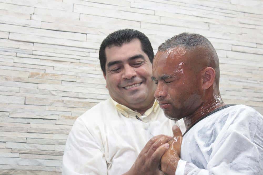 A pastor baptizing an adult man