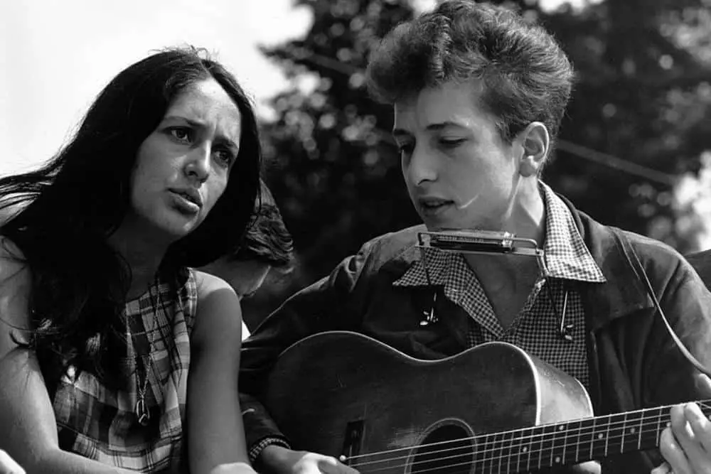 Young Bob Dylan singing a song with a girl