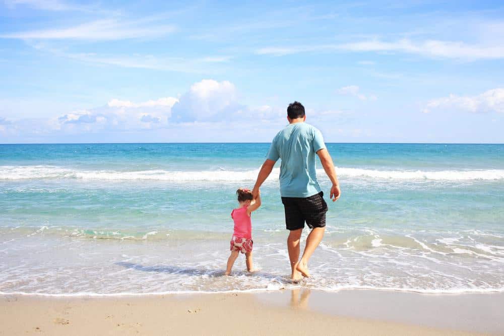 Father and child at the beach