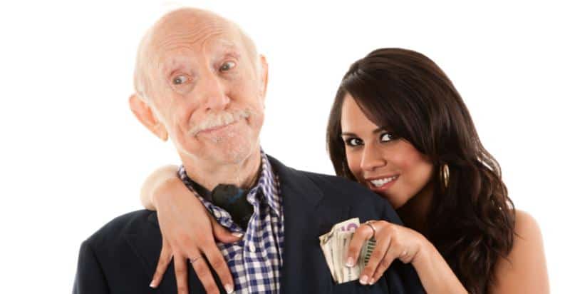 Person holding a stack of cash