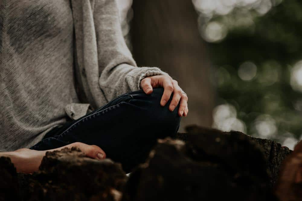 A person meditating in nature