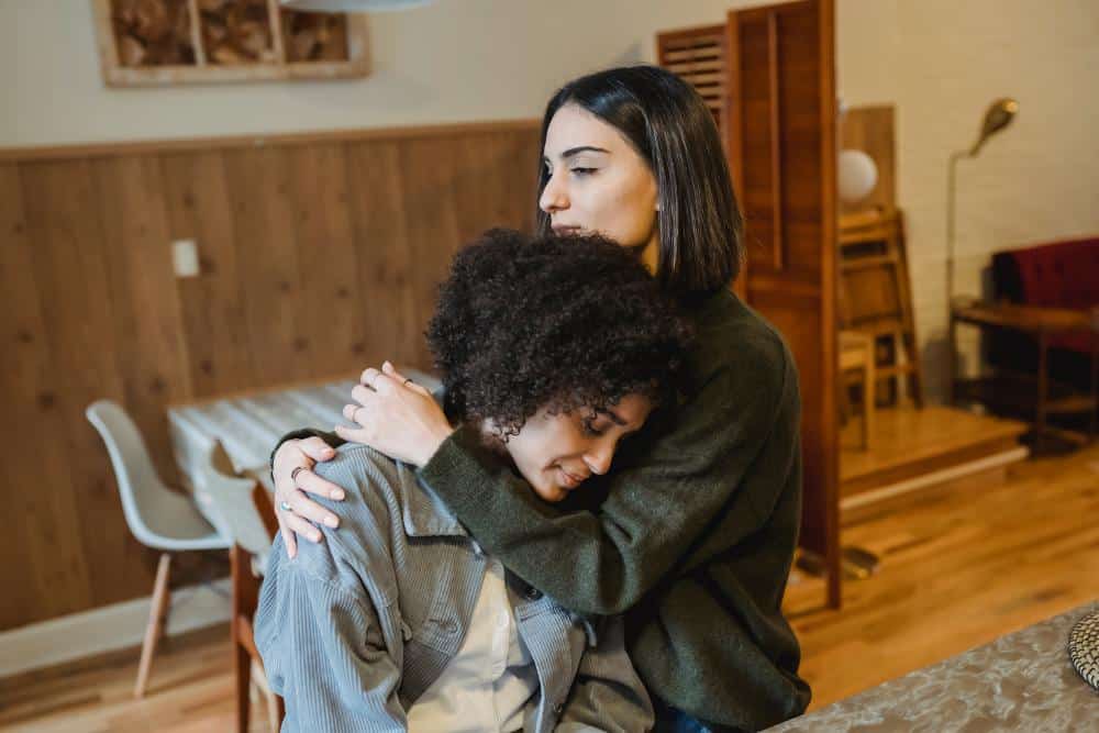 A girl consoling her friend