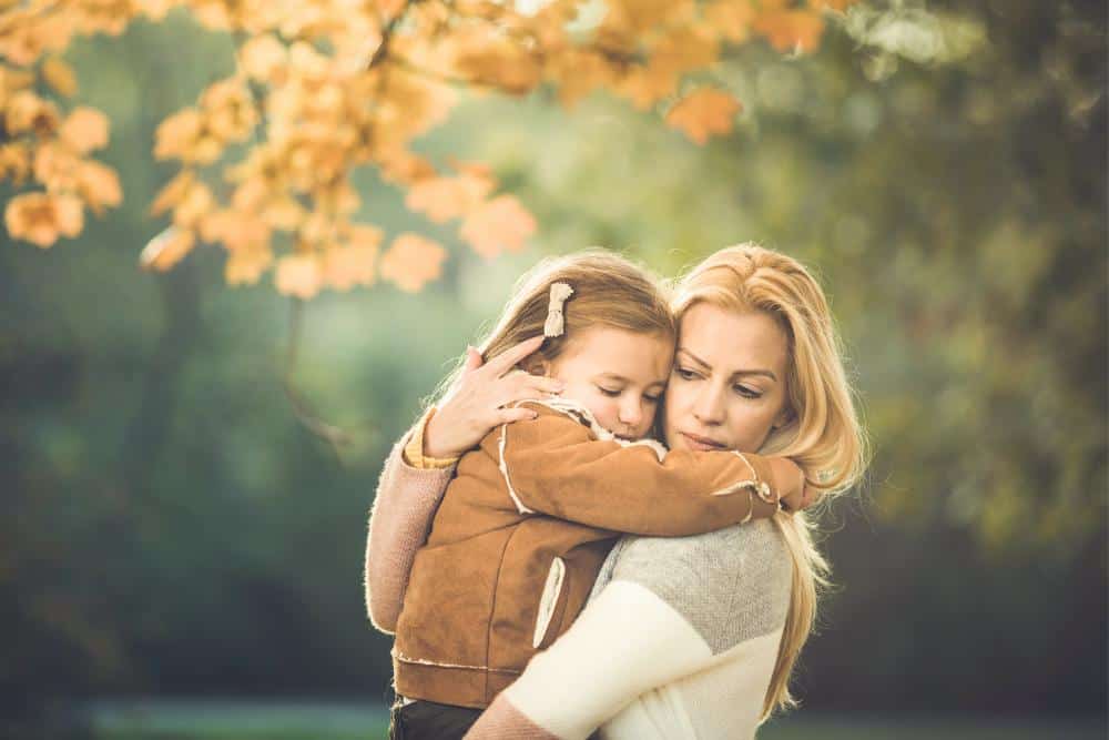 A mother telling her child it will be okay