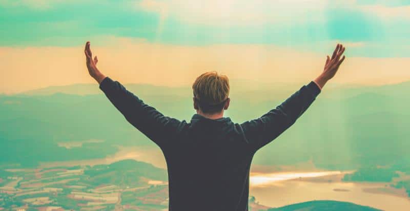 a person standing on the mountains