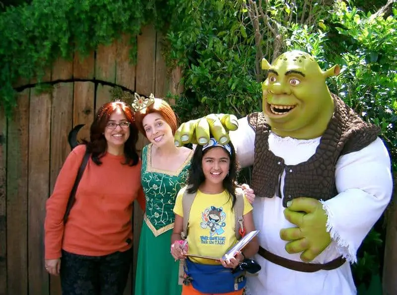 People taking photographs with Shrek statue