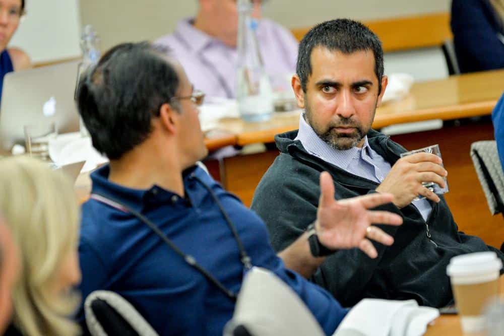 Balaji Srinivasan holding a glass of water