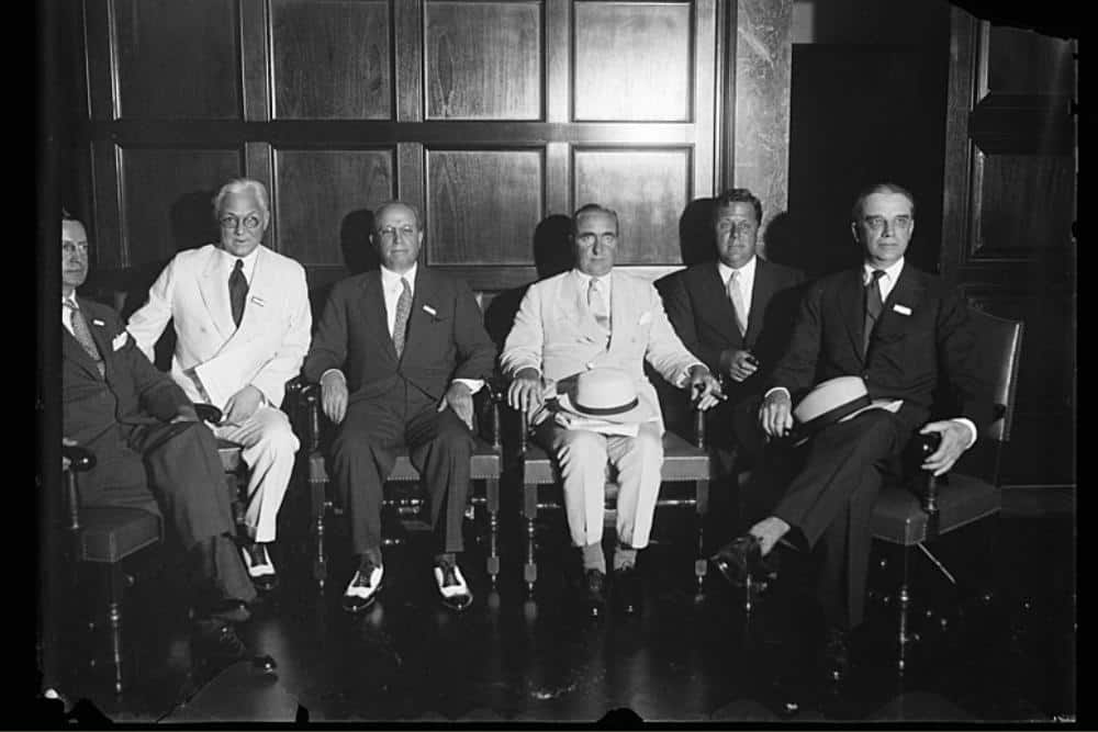 Ogden Nash sitting in a formal gathering